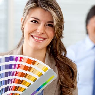 Choosing a refinishing color from a fan deck of color samples