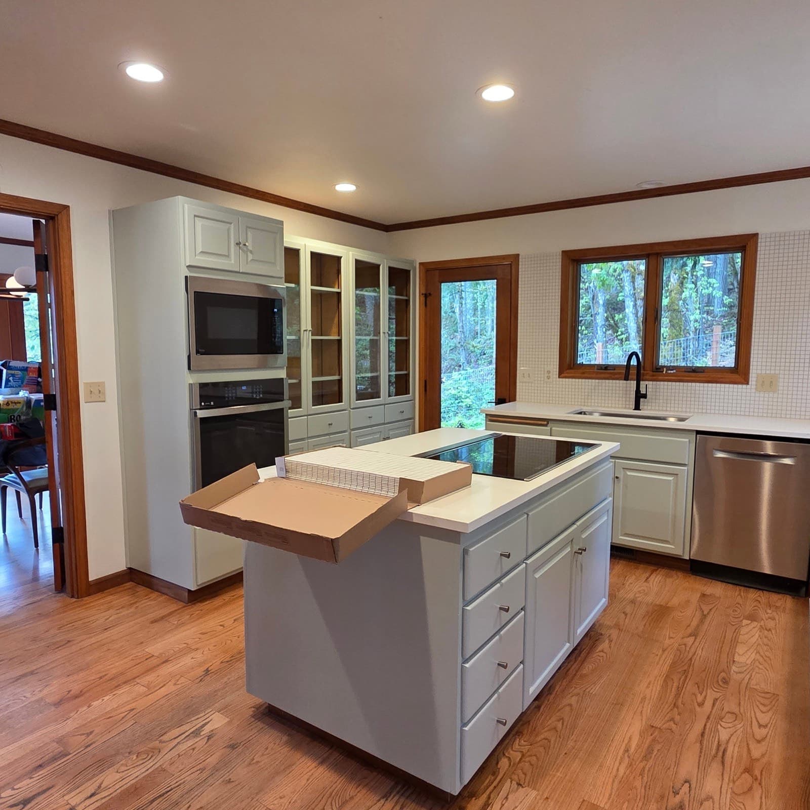 A real BSS project: a kitchen transformed with freshly refinished white cabinets, island and tile