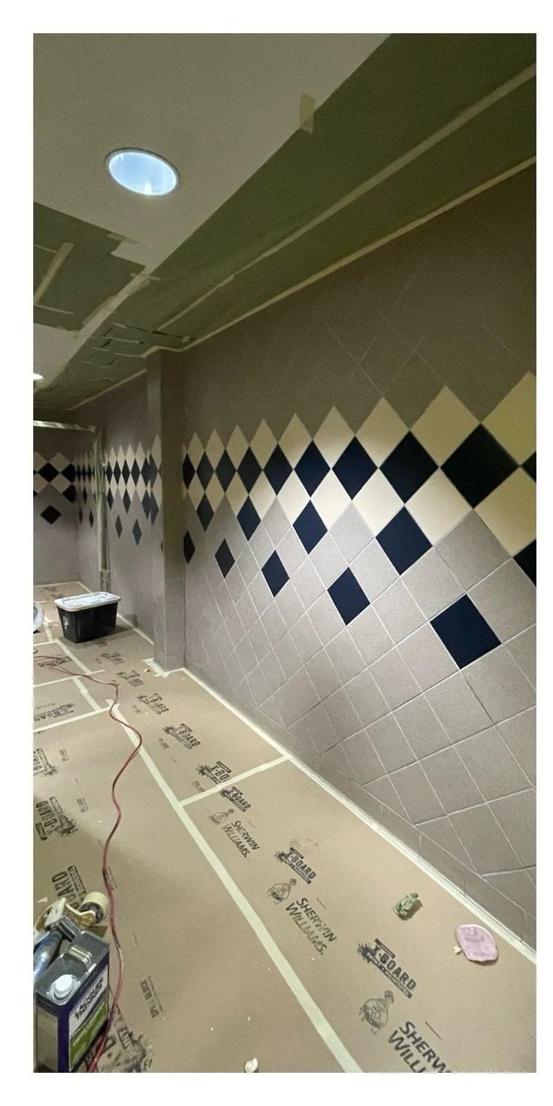 Before: Commercial restroom diamond-pattern tile wall before and after refinishing