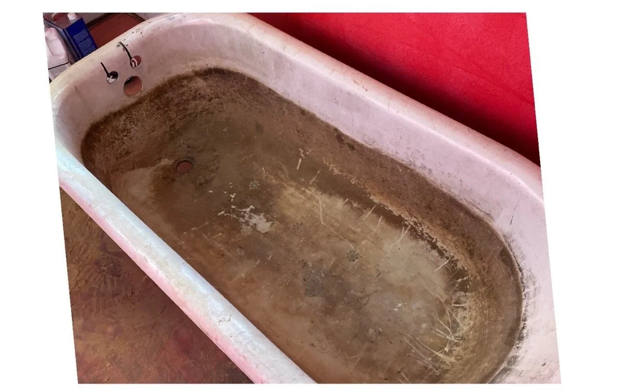 Before: Brown stained and worn tub interior before refinishing beside the same tub refinished in clean white