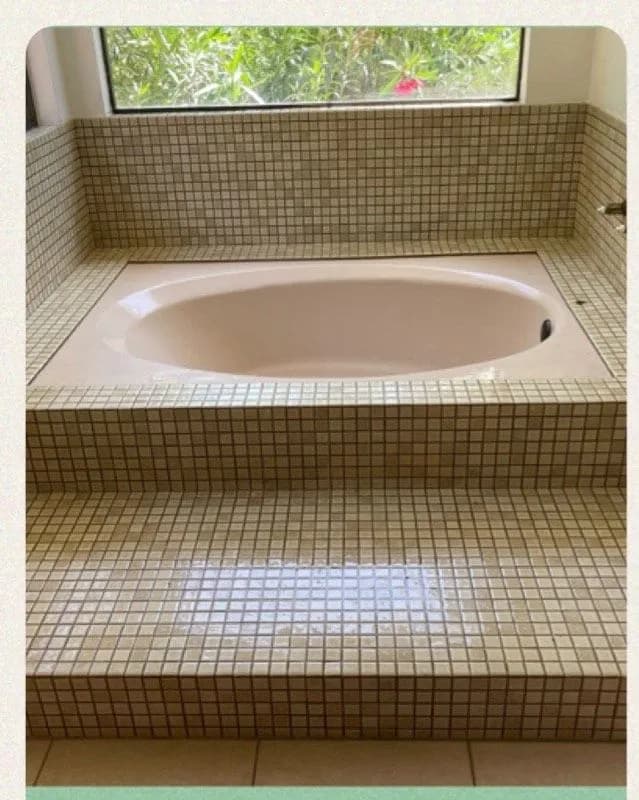 Before: Round soaker tub worn and stained beside the same tub refinished in clean white