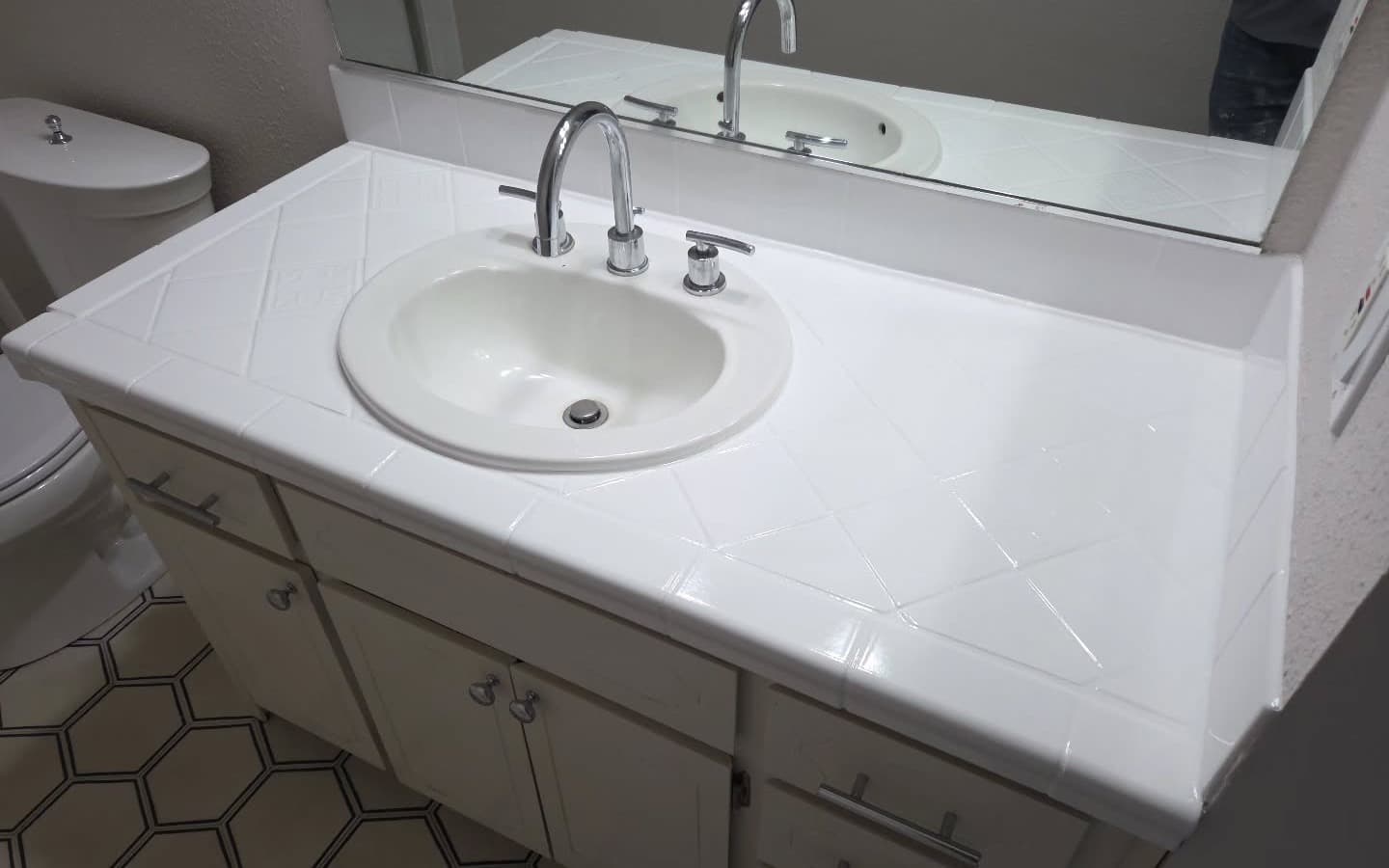 A real BSS project: a bathroom vanity and tile countertop refinished to a glossy bright white